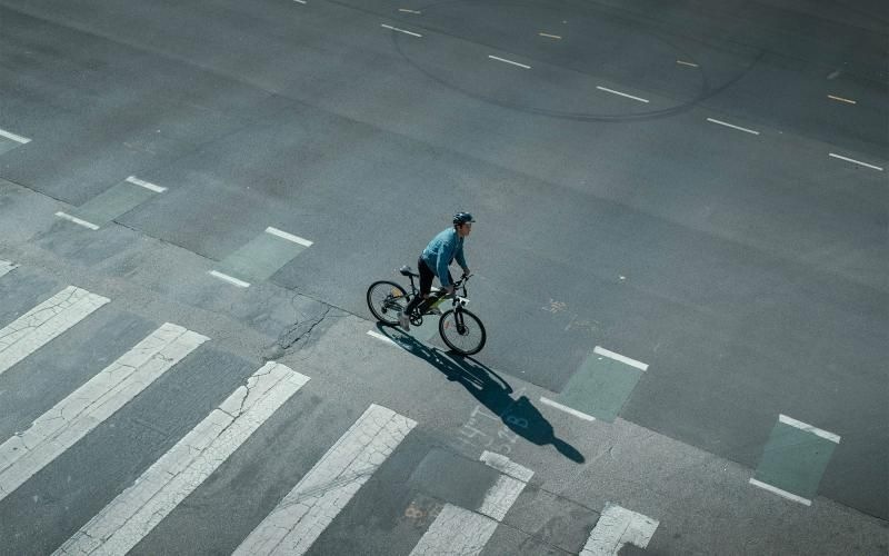 Find your perfect fit at Alta Vue Apartments a person riding a bicycle on a street