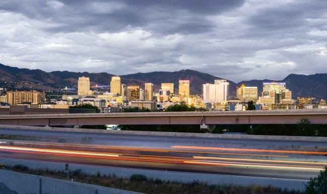 a city skyline with a bridge