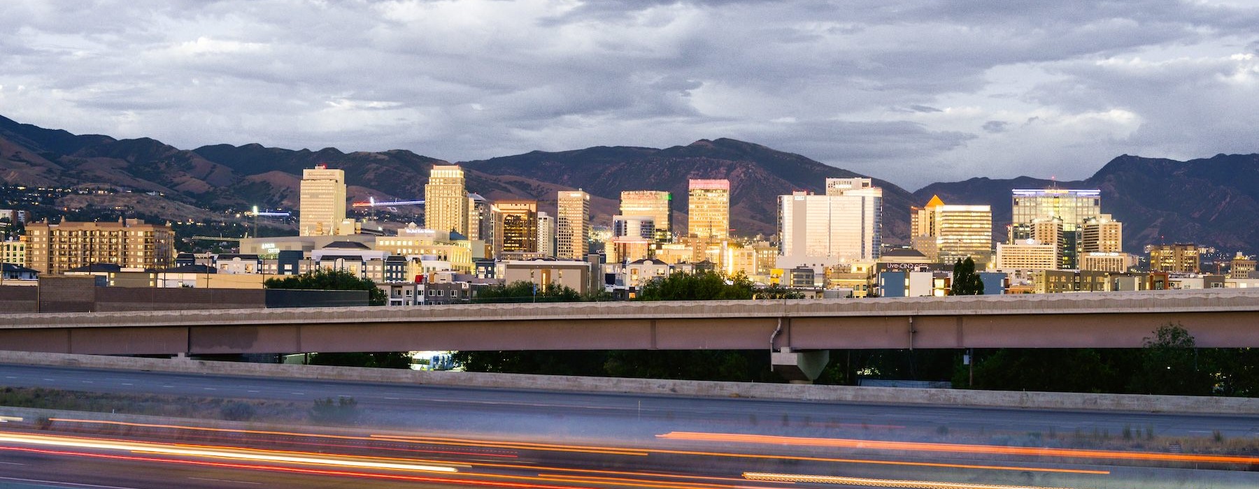 Settle into comfort at Alta Vue Apartments a city skyline with a bridge